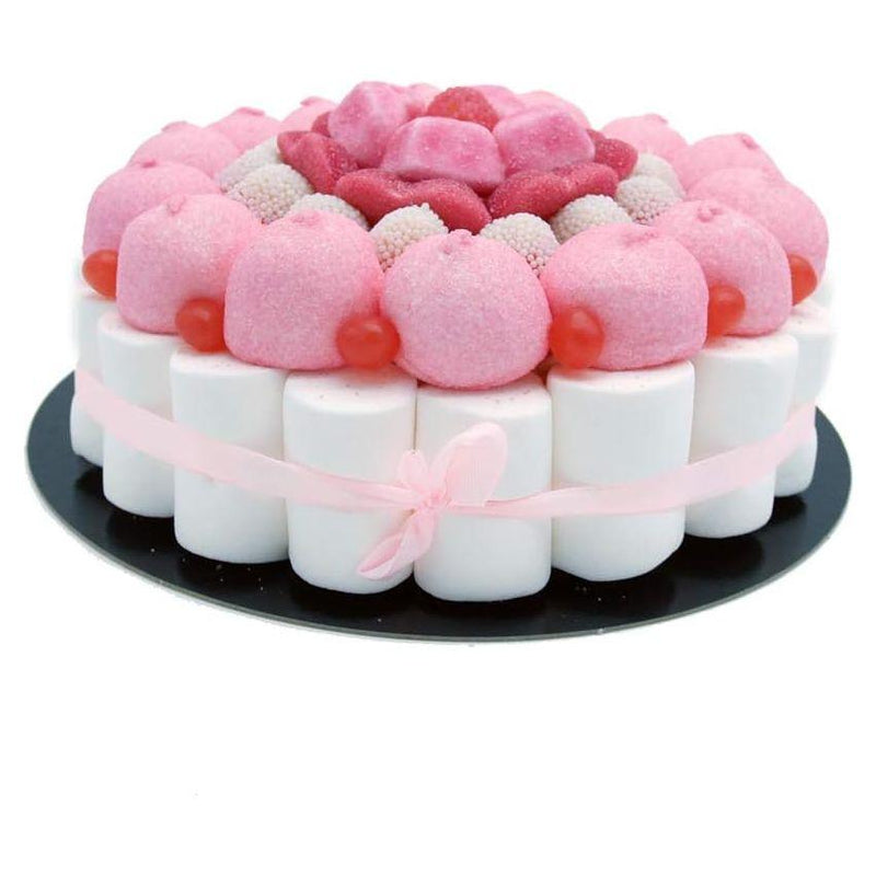 Tarta de chuches Pink Banano en tono rosa con golosinas surtidas, mariposas y corazones